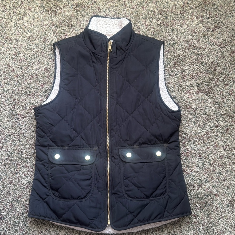 Small gently used reversible vest with pockets.
